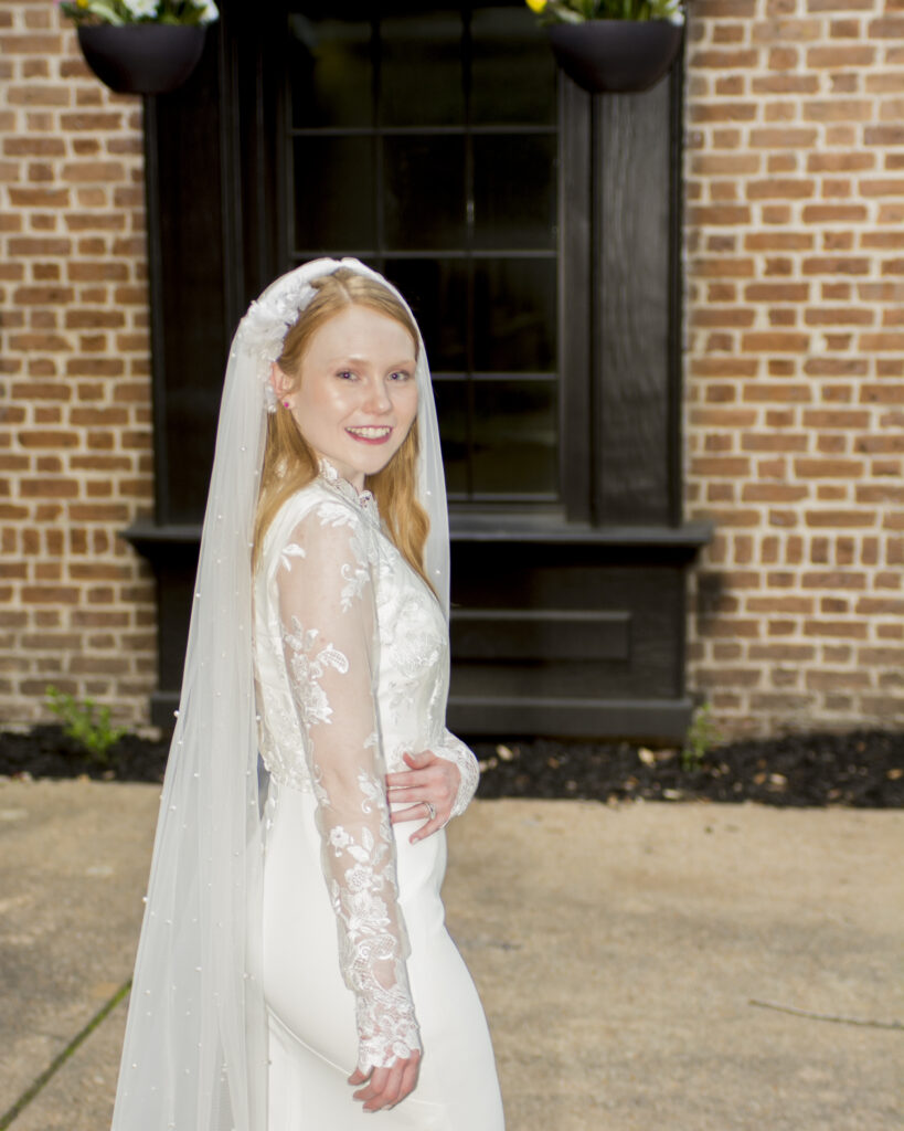 A bridge in her wedding dress posing on her special occasion